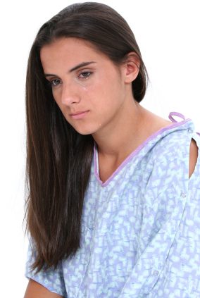 Beautiful Teen Girl In Hospital Gown Crying